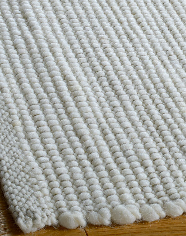 Tappeto intrecciato in lana