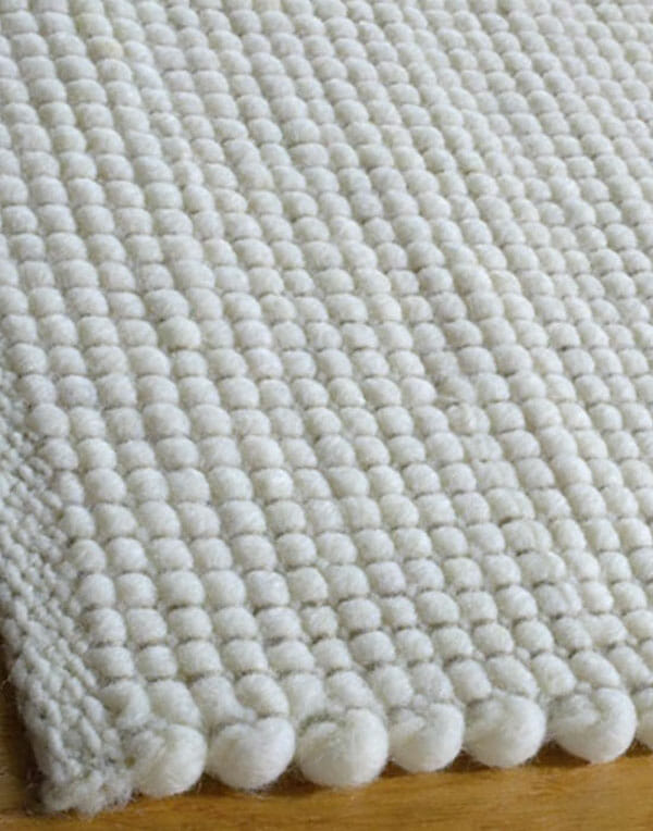 Tappeto nordico intrecciato in lana. Su misura